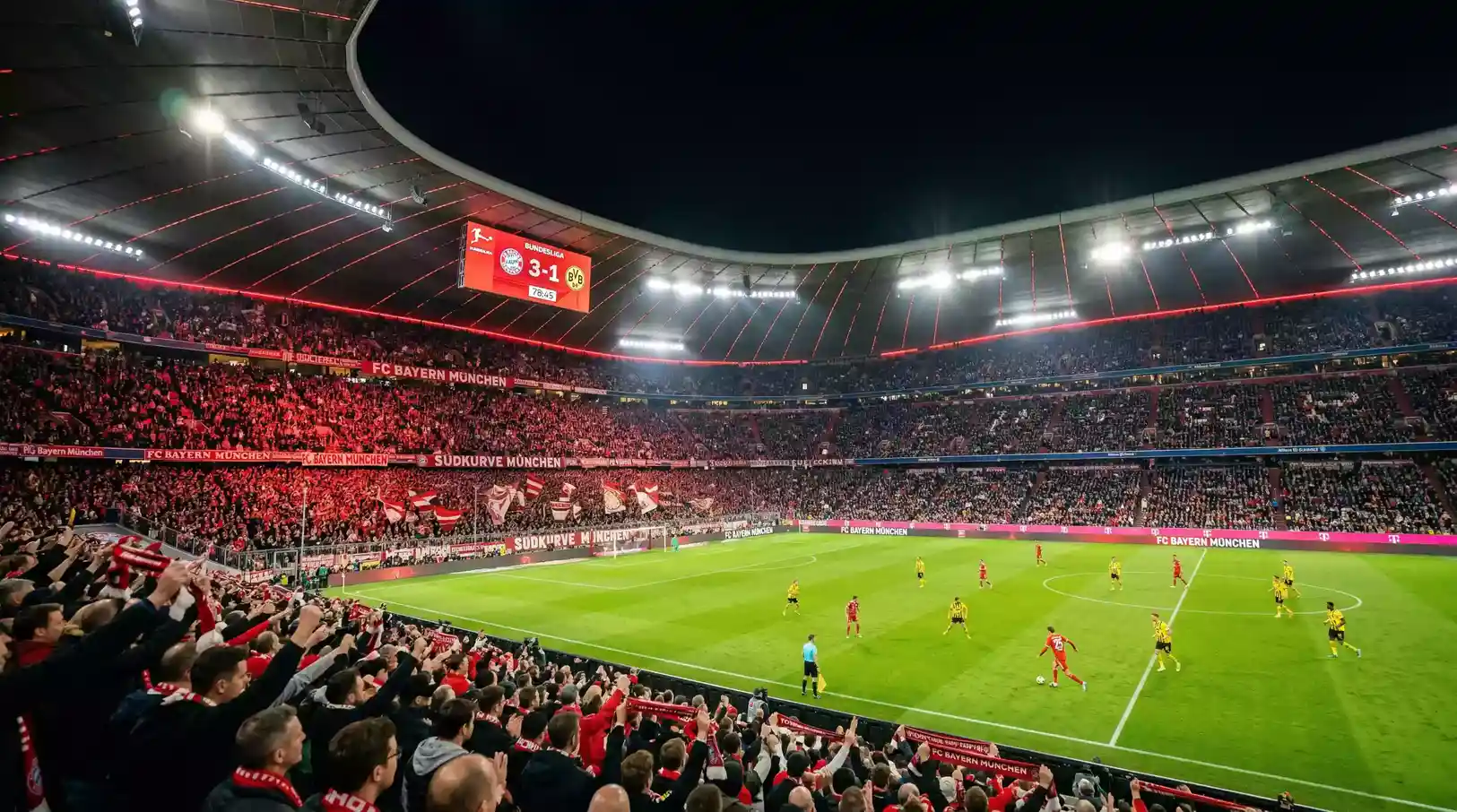 Estadio del Bayern München durante un partido de Bundesliga con la grada llena y el campo iluminado
